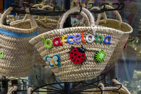 Close up view of several straw bags for sale in Barcelona, Spain.の写真素材