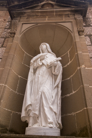 Statues located in the benedictine abbey landmark site located in the Montserrat mountains, Spain.のeditorial素材