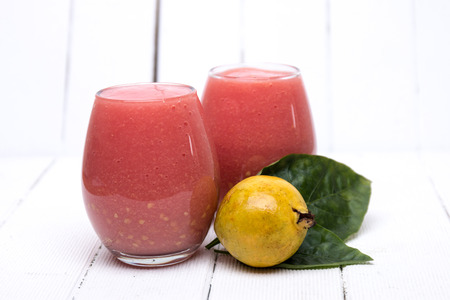 Close up view of fresh guava juice on a white background.の写真素材