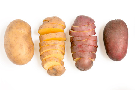 Close up view of potatoes isolated on a white background.の写真素材
