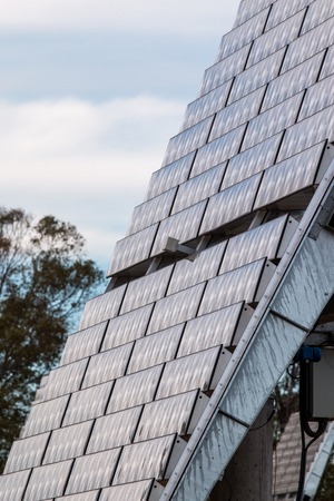 Upward close view of a photovoltaic solar panel gathering energy.の写真素材
