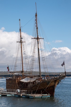 Vintage restored Caravel ship anchored in the docks of Portimao city, Portugalの写真素材