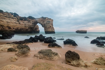 Beautiful low tide view of the Albandeira beach located in the Algarve region, Portugal.の写真素材