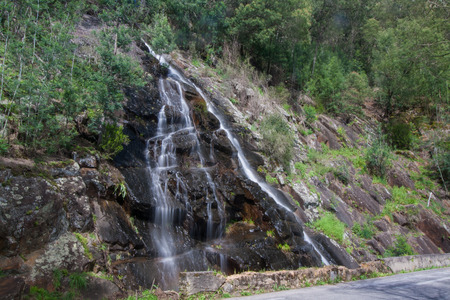 Natural waterfall in the mountains roads of Lousa, Portugal.の写真素材