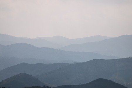 Mountain layers in the foggy mystical morning.の写真素材