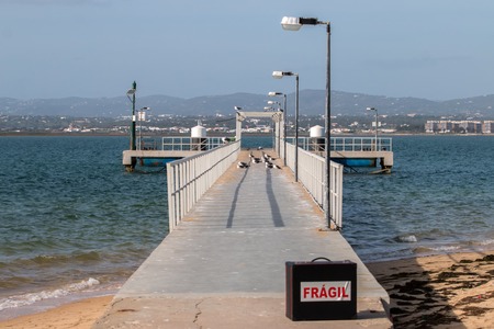 View of the footbridge on culatra island in the Algarve region.