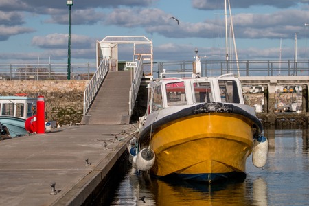 View of the olhao city docks with traditional fishing boats.の写真素材