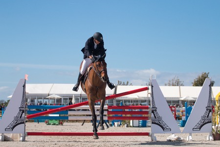 VILAMOURA, PORTUGAL - APRIL 2, 2016: Horse obstacle jumping competiion, called Vilamoura Atlantic Tour that brings the finest athletes to the event.のeditorial素材