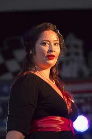 FARO, PORTUGAL - AUGUST 27, 2016: Fashion pinup contest on the classic vehicles exhibition outdoor event called American Cars Algarve.のeditorial素材