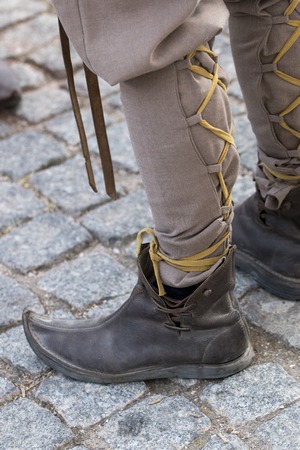 Close up view of some curved medieval shoes.