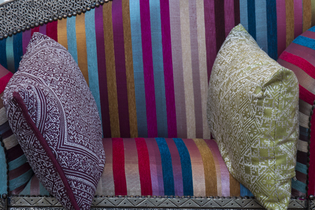 Close up view of a colorful moroccan couch with pillows.の写真素材
