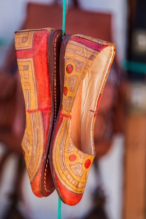 Close up view of colorful moroccan shoes at sale.の写真素材