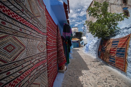 Moroccan carpets at sale in the streets of Chefchaouen city.の写真素材
