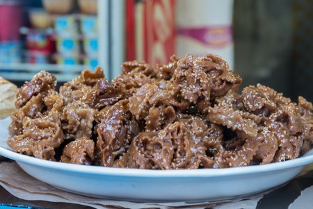 Tasty chebakia honey cookies with sesame seeds on a shop.の写真素材