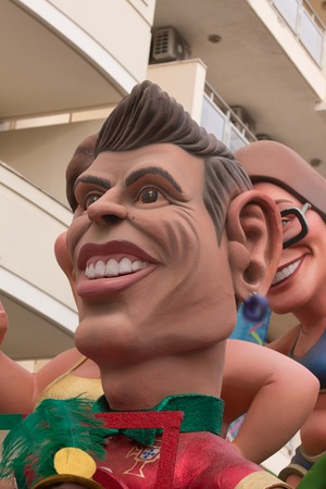 LOULE, PORTUGAL - FEB 2016: Colorful Carnival (Carnaval) Parade festival puppets on Loule city,...