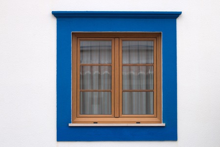 Close up view of a traditional portuguese window on a house.の写真素材
