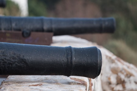 Close up view of an old portuguese military cannon.