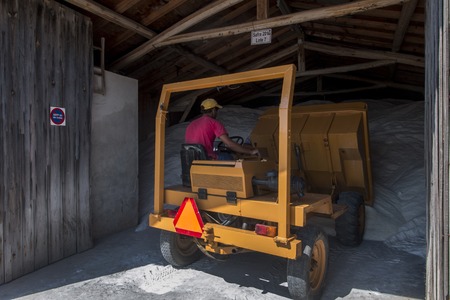 RIO MAIOR, PORTUGAL - July 20th, 2016 : Workers gathering marine salt from the famous saline...