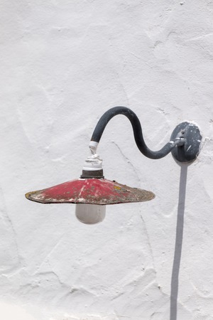 Close up view of and old rusty streetlamp.の写真素材