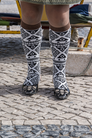 NAZARE, PORTUGAL - JULY 20, 2016: Detail from socks of a traditional dressed Nazare lady.のeditorial素材