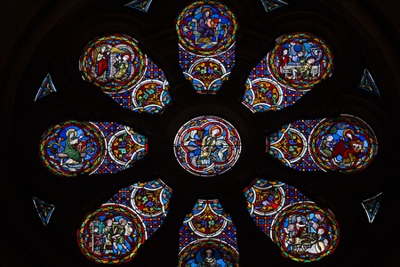 Close up view of a colorful stained glass rosette.のeditorial素材