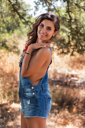 Beautiful girl in a nature autumn theme.の写真素材