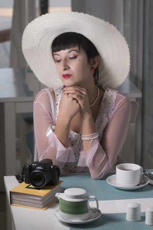 Beautiful and cute classic themed pinup girl on a bar.の写真素材