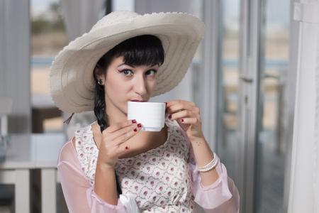 Beautiful and cute classic themed pinup girl on a bar.の写真素材