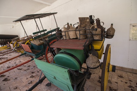 Exhibit of old transport carts in a museum of Sao Bras de Alportel, Portugal.のeditorial素材