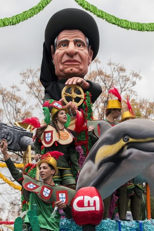 LOULE, PORTUGAL - FEB 2017: Colorful Carnival (Carnaval) Parade festival participants on Loule city,...