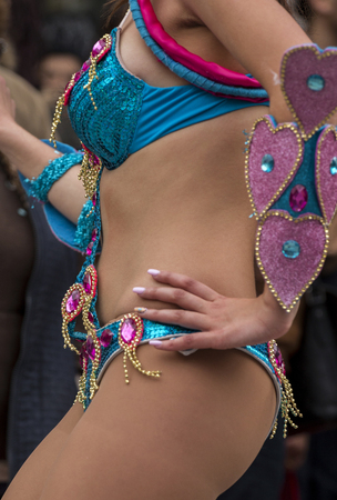 Detail on the female dancers on the colorful Carnival (Carnaval) Parade festival on Loule city, Portugal.の写真素材
