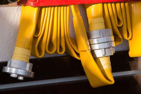 Yellow Fire hose on a tall ship.の写真素材