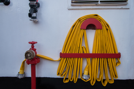 Yellow Fire hose on a tall ship.の写真素材