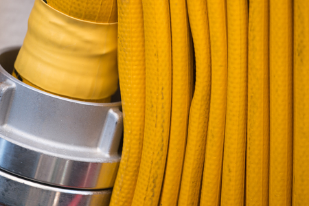 Yellow Fire hose on a tall ship.の写真素材
