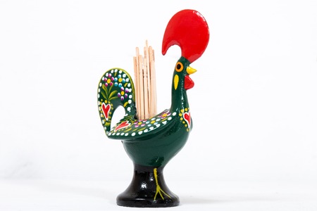 Toothpicks inside a Barcelos Rooster over a white background.の写真素材