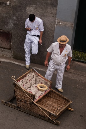FUNCHAL, MADEIRA - 19th JUNE, 2017: Traditional toboggan riders relaxing until the next trip.のeditorial素材