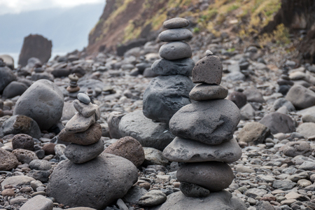 Zen style balanced stones on Ribeira da Janela beach, Madeira island, Portugal.のeditorial素材
