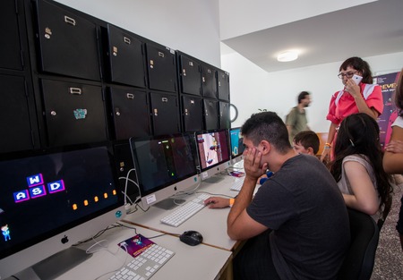 FARO, PORTUGAL - August 19, 2017: Gamers play computer games in the Manga & Comic Event.