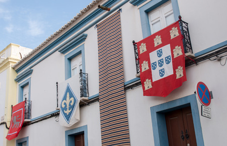 Old Medieval Portuguese flags on a Medieval fair in Castro Marim, Portugal.のeditorial素材