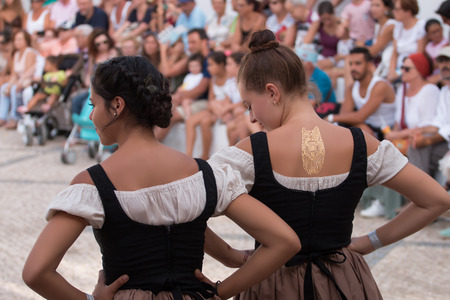 CASTRO MARIM, PORTUGAL - AUGUST 25, 2017: Girls in Medieval costume in Medieval fair event.のeditorial素材