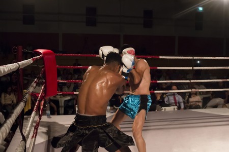 Kickboxer in the ring fighting another athlete.のeditorial素材
