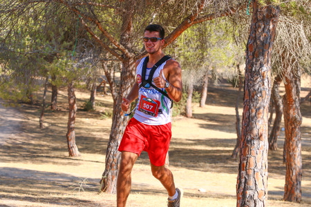 FARO, PORTUGAL - 24th September 2017: Runners in a forest trail performing on a 25km run.のeditorial素材