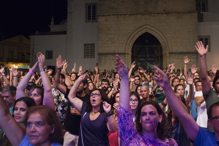 FARO, PORTUGAL: 01st SEPTEMBER, 2017 - Audience watching the music band, Black Mamba, performing on Festival F, a big festival on the city of Faro, Portugal.のeditorial素材