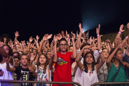 FARO, PORTUGAL: 03rd SEPTEMBER, 2017 - Audience watching the music band, HMB, performing on Festival F, a big festival on the city of Faro, Portugal.のeditorial素材