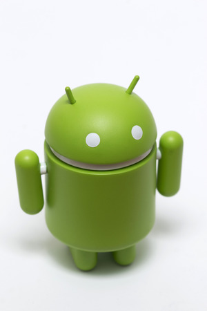 OLHAO, PORTUGAL - 6th november, 2017 - Famous Android mini collectible figure, that represents the mobile operating system developed by Google isolated on a white background.のeditorial素材