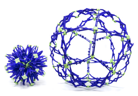 Collapsible purple and green color sphere isolated on a white background.