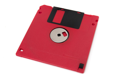 red computer floppy disk, back view, isolated on a white background.の写真素材