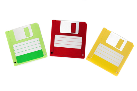 colorful computer floppy disks on a composition isolated on a white background.の写真素材