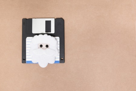old floppy disk concept isolated on a brown background.の写真素材