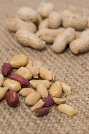 peanuts on a composition on a burlap background.の写真素材